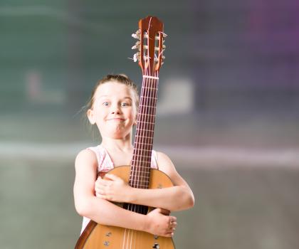 Girl with Guitar - Support your child's success in music study